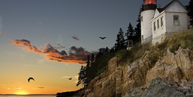 lighthouse on the rocky coast of New England.