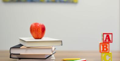 books with an apple on top