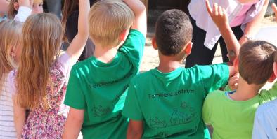 children raising their hands