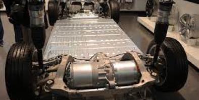 Picture of the base frame of a car with an electric engine in the front.
