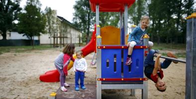 Children playing on a playground structure.